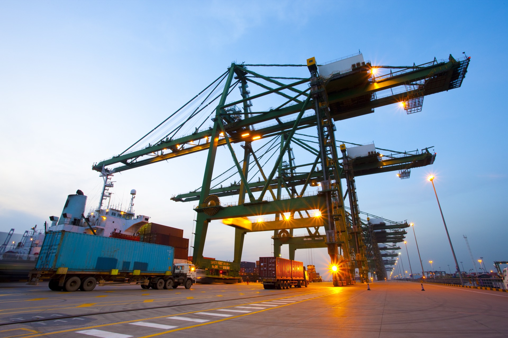 Container port cranes at dusk