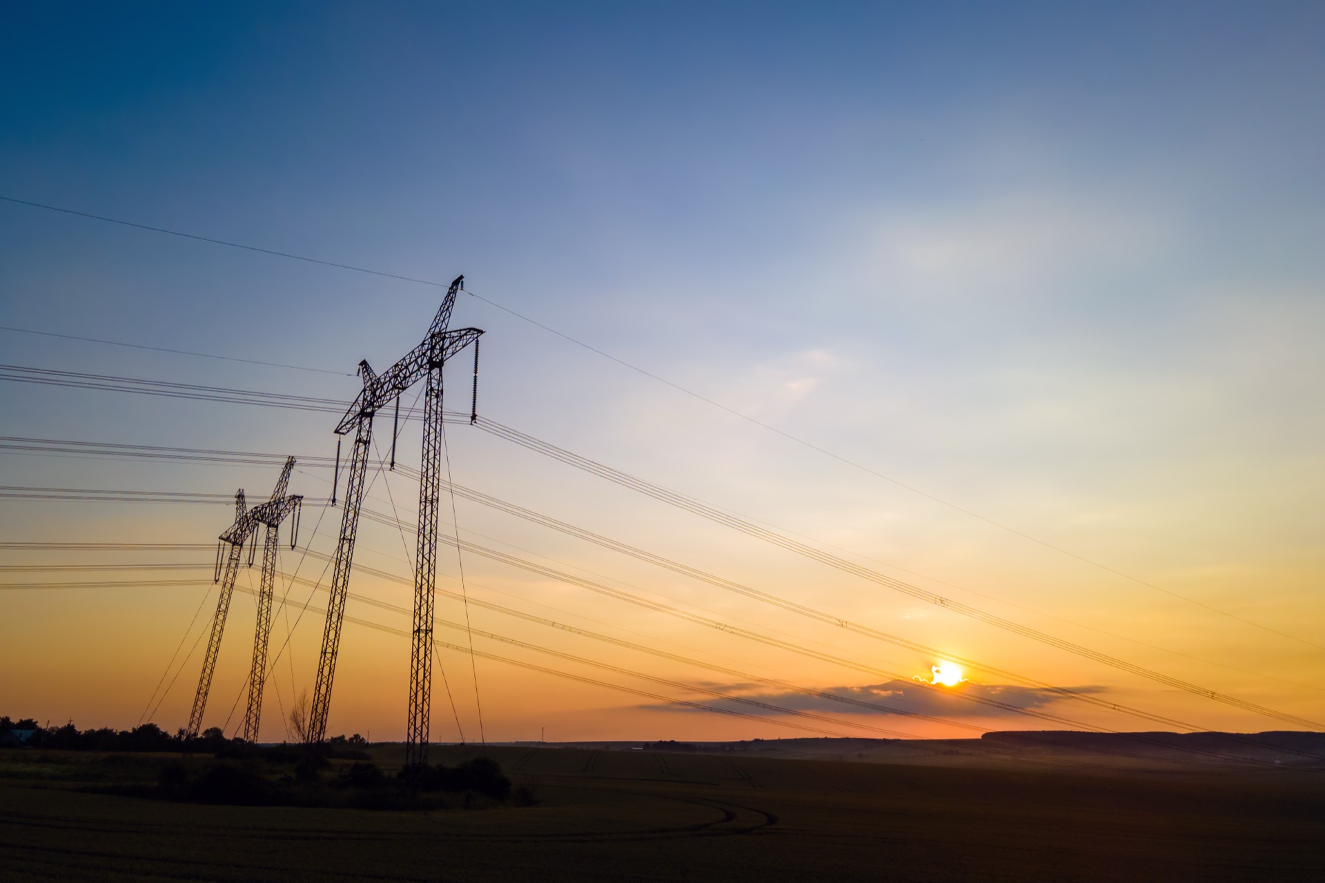 Power transmission lines at sunrise